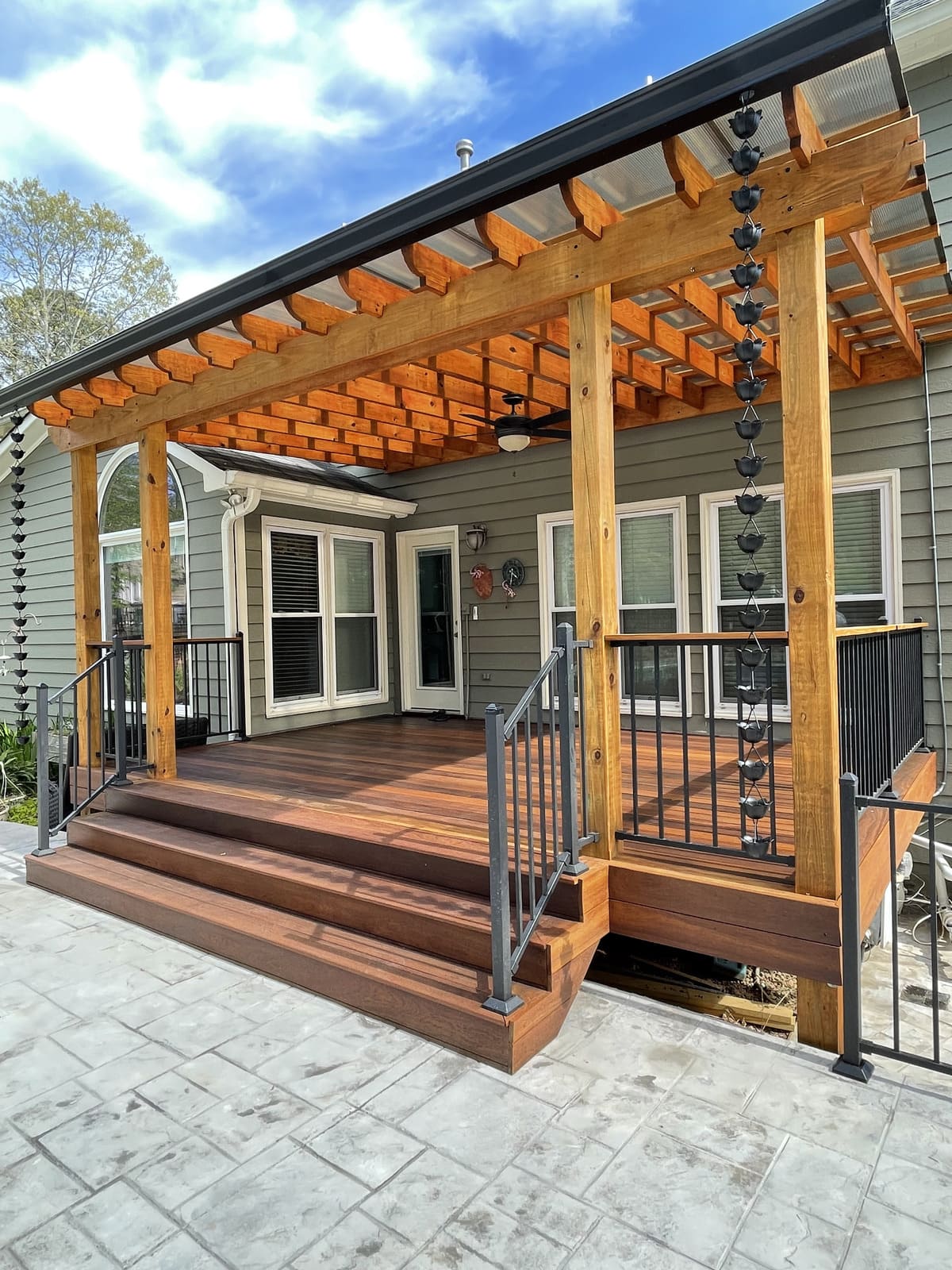 Deck featuring a custom pergola