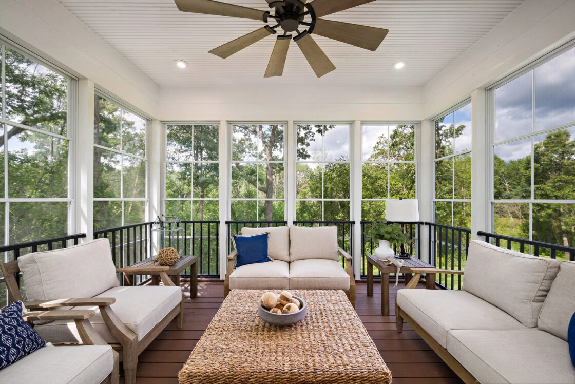 Custom screen porch with railing and lightning on it with beautiful nature scenery outside