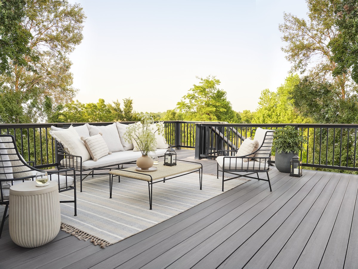 Gray pvc decking with black railing and outdoor living furnitures