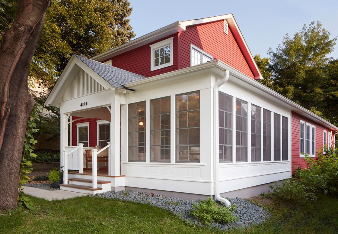Perspective view of the white screen porch windows with enclosed front porch
