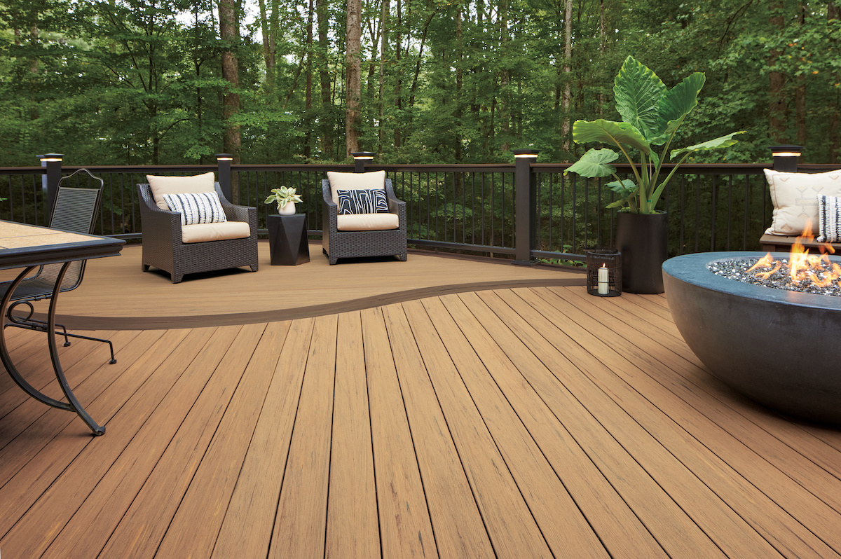 Walnut pvc decking with outdoor living furnitures and fire pit with overlooking nature view